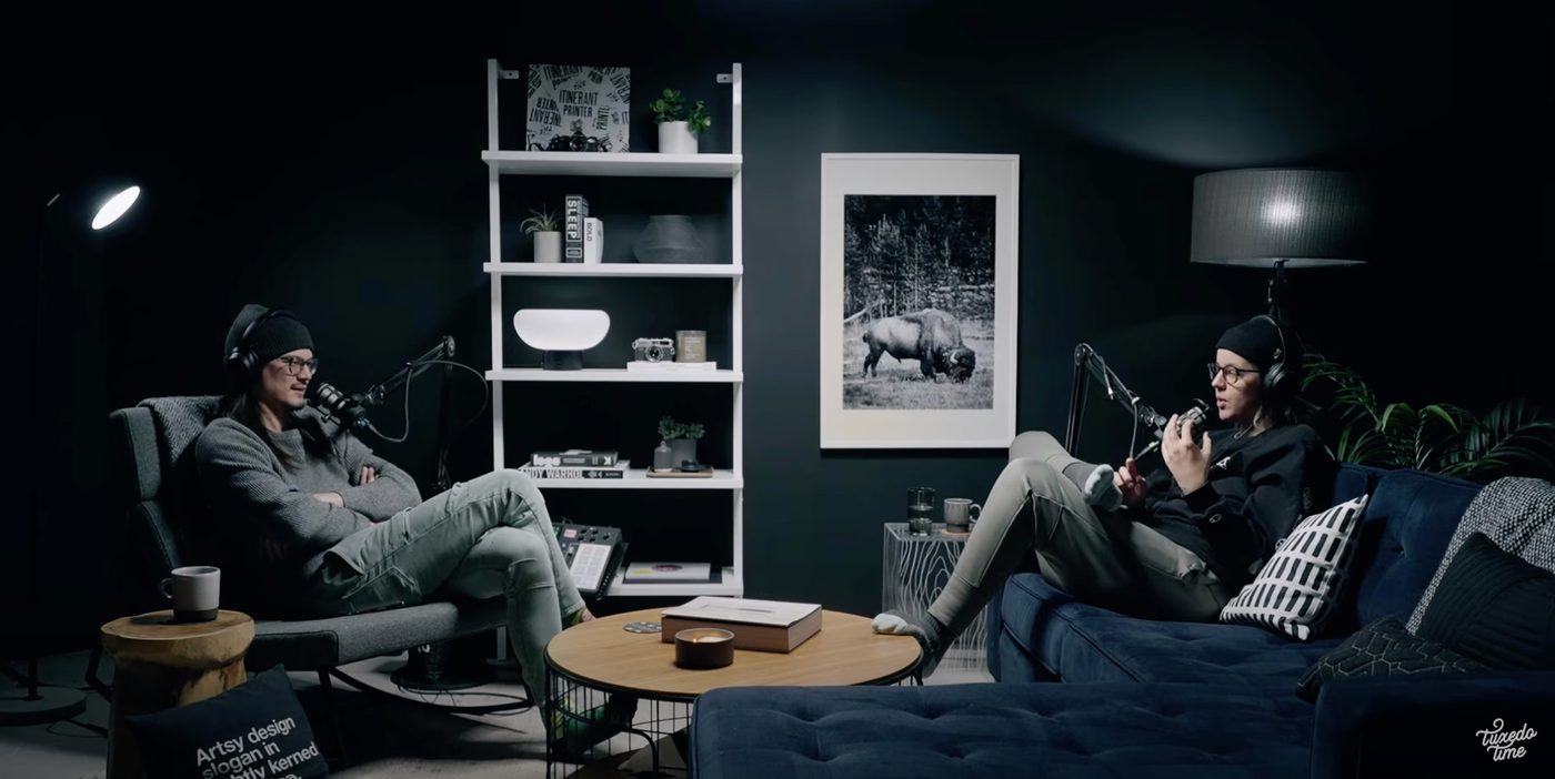 Two people mid-conversation across a studio table
