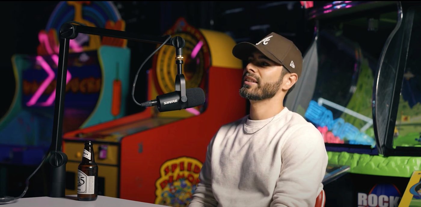 A recording setup against a bright mural backdrop